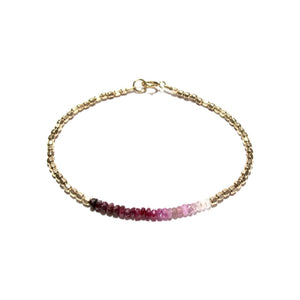 shaded ruby line and gold beads bracelet