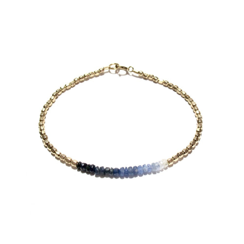 shaded sapphires line and gold beads bracelet