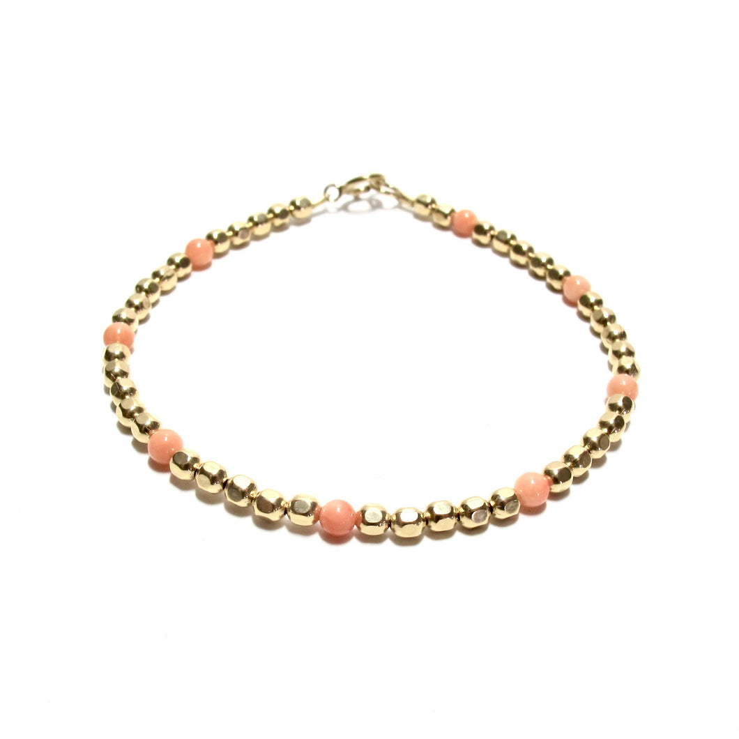dotted coral medium faceted beads bracelet
