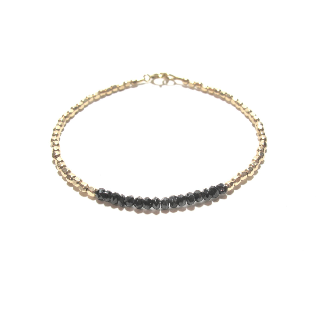 black spinel line and gold beads bracelet