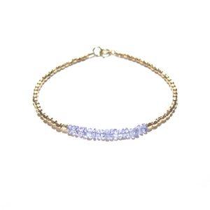 tanzanite line and gold beads bracelet