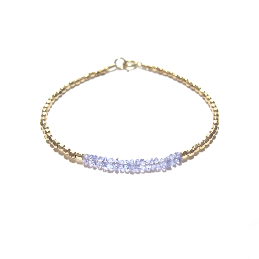 tanzanite line and gold beads bracelet