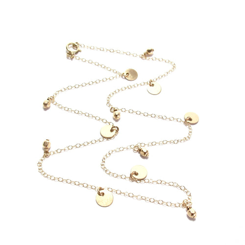 multi discs and gold beads necklace